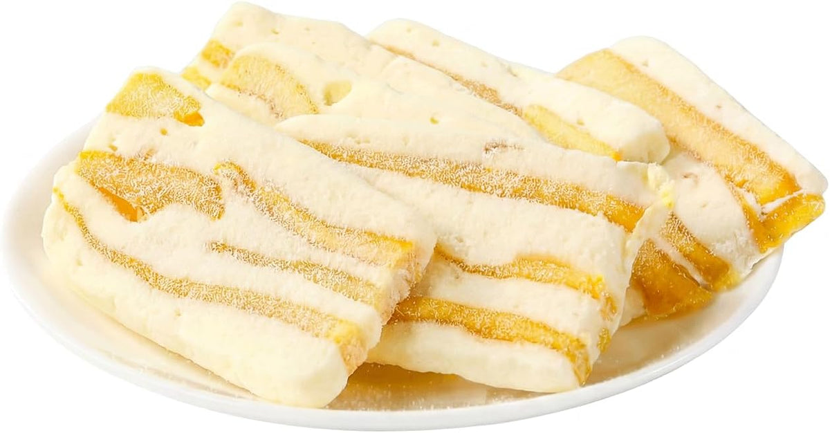Side view highlighting the layers of dried mango and creamy milk nougat.