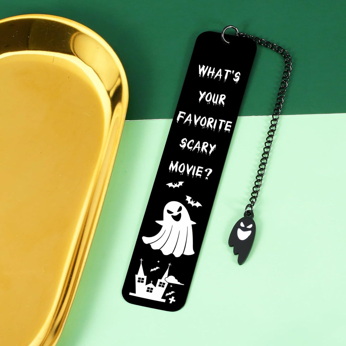 Raddimelo book lover bookmark showcasing the attached hanging chain and ghost charm
