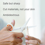 Slice safety scissors showing white ceramic blade close-up
