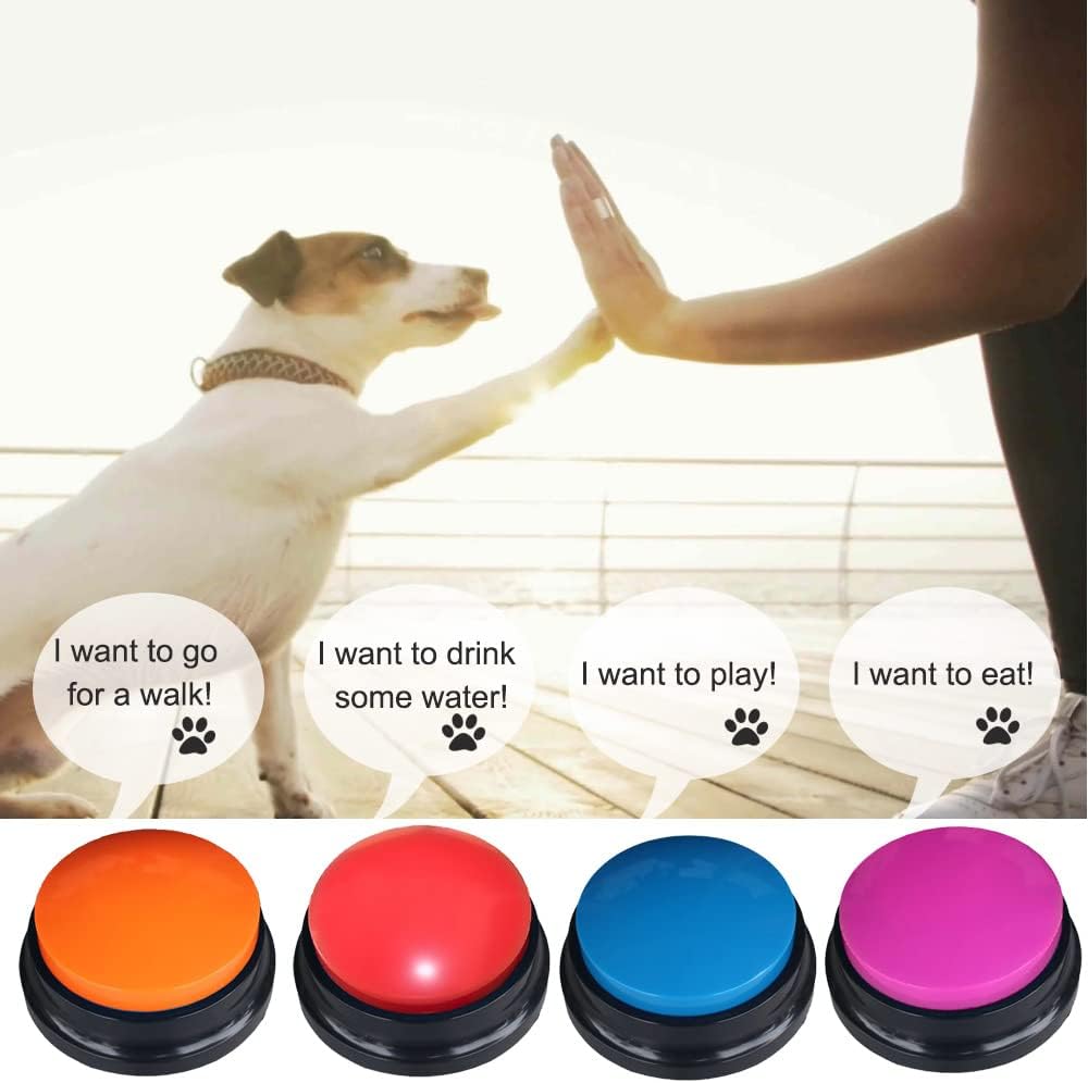 Multi colored talking buttons for dogs being pressed by a hand.