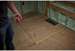 Milwaukee 25ft tape measure in hand
