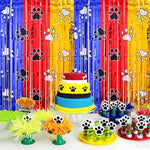 Two pack of paw print metallic streamer backdrops installed on a standard household doorway for a kids birthday party.