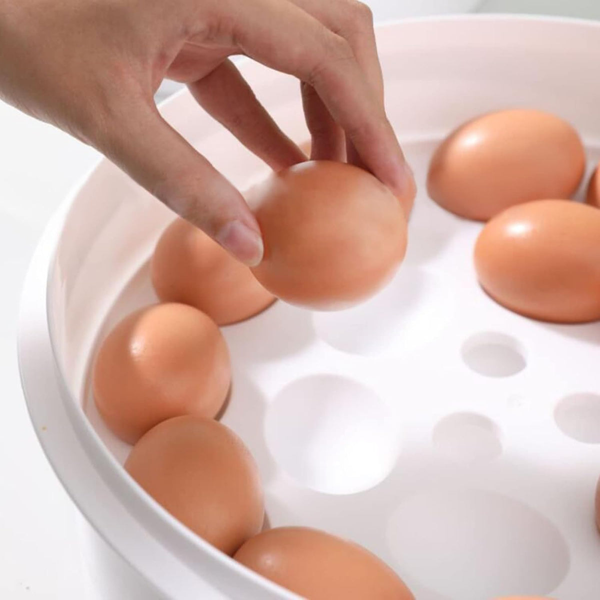 Pujito portable food keeper showing egg holder functionality