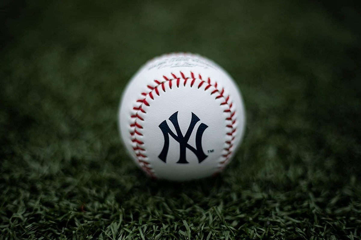 Side profile of Rawlings MLB team logo baseball on display