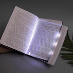 Generic LED flat book light shown in a travel bag