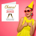 Stylized lifestyle shot of the anniversary card next to a gift