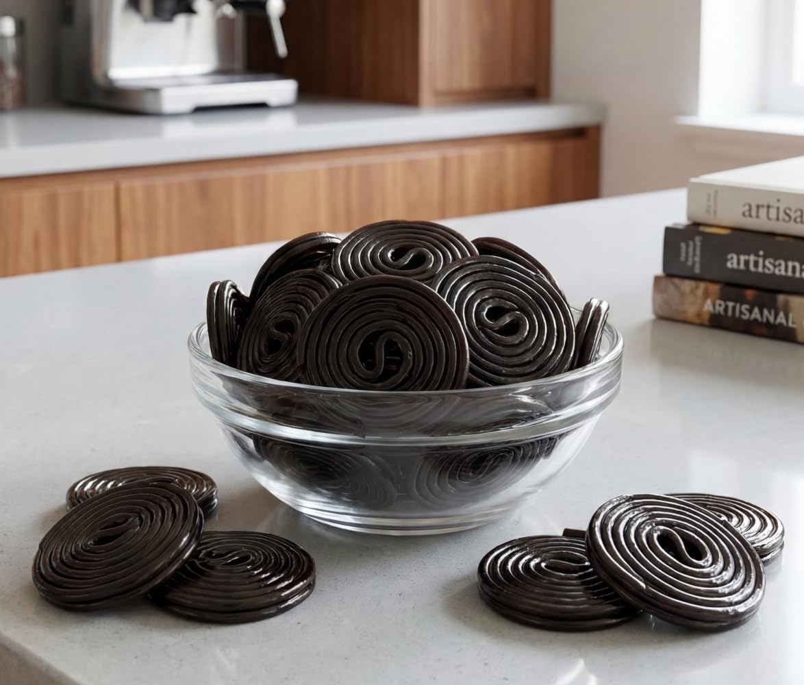 A single DM Sweets Black Licorice Wheel partially unrolled to display the long playful strand structure.