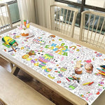 Festive Easter party setting featuring the color-in rectangular table cover with crayons arranged in holders.