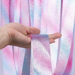 Girl in a ballerina tutu practicing artistic dance steps with a sparkling laser ribbon.
