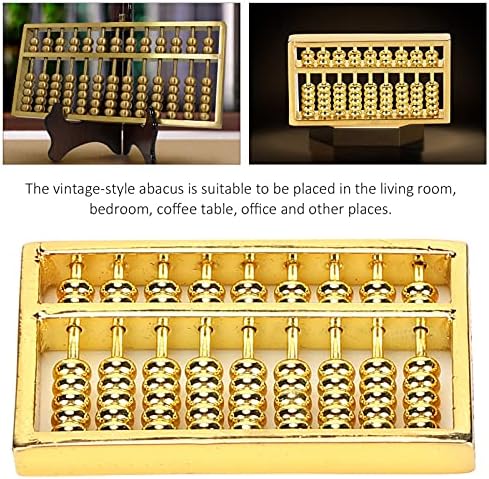 Handheld brass abacus showing metallic luster