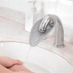 Calsgkspray faucet extender for toddlers front view showing grey silicone leaf design attached to a bathroom tap
