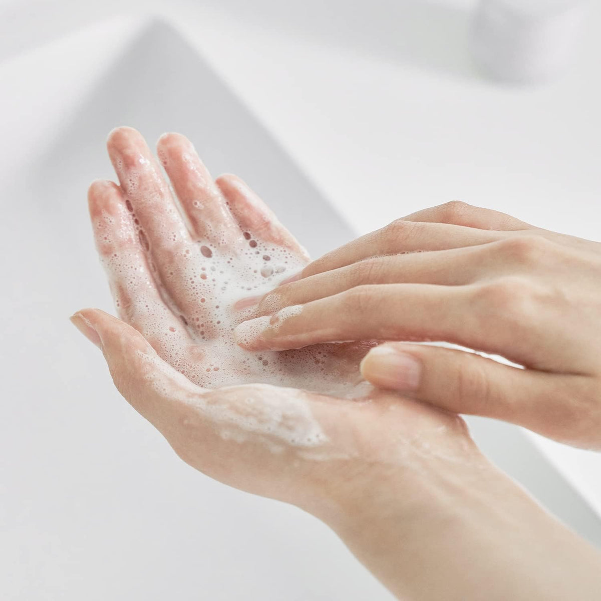 Texture shot of the Celimax low pH barrier repair cleansing gel turning into a silky soft lather.