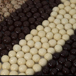 Gourmet chocolate covered coffee beans from Dilettante poured into a serving bowl for hosting.