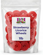 DM Sweets premium strawberry licorice wheels unrolled on a clean white surface.