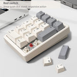 Kisnt KN17 wired number pad connected next to a compact laptop