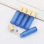 Kesell roll on bottles displayed with bottle opening tool