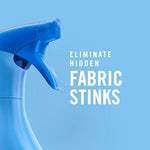 Febreze fabric refresher being used on a travel bag for freshness