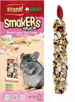 Vitapol Smakers natural vegetable chew sticks next to a hamster cage setup illustration