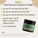 Hand holding Black Sheep Organics peppermint dog toothpaste 59 milliliters