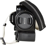 Gray grosgrain ties attachment mechanism on camera strap
