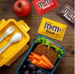 Premium imported M&MS three pounds collection poured out into a party serving dish