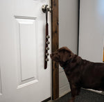 Dog potty training bells hanging on a door handle