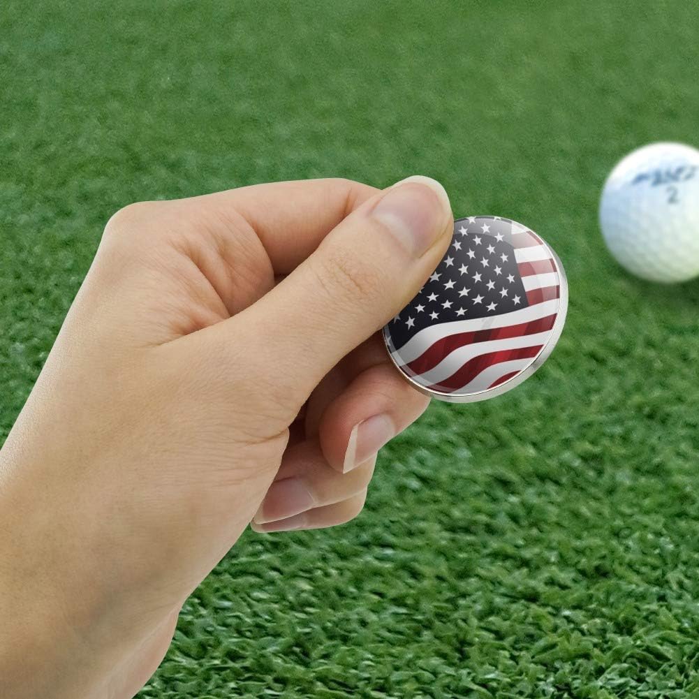 Close up of chrome plated metal golf ball marker with waving stars and stripes design