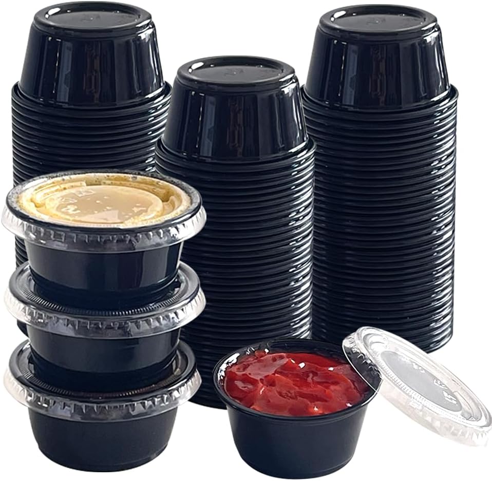SUCITY 2 ounce black condiment cups with lids front view for sauce storage.