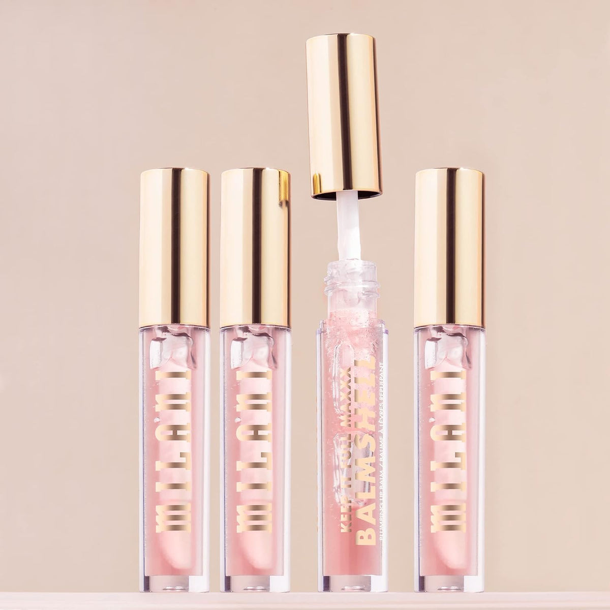 Milani high comfort volumizing lip balm placed upright on a clean reflective vanity surface