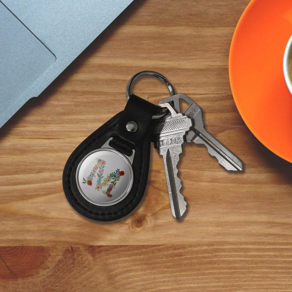 Black leather keychain displaying silver-plated hardware and ring