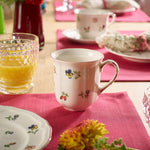 Close up of floral and berry motifs on German porcelain cup