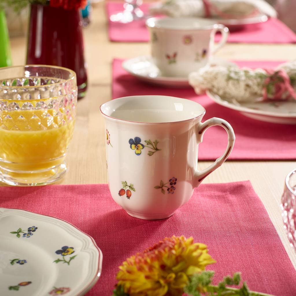 Close up of floral and berry motifs on German porcelain cup