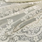 Full view of the 72 by 72 inch beige Victorian style decorative lace panel inside a modern bathroom