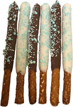 Artisanal baby blue chocolate pretzel rods with sprinkles and pearls