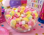 Close up view of the gelatin free sour skulls and foam ovals from the imported candy assortment.