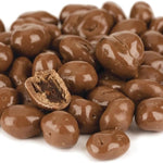 Close up of milk chocolate covered raisins showing smooth coating