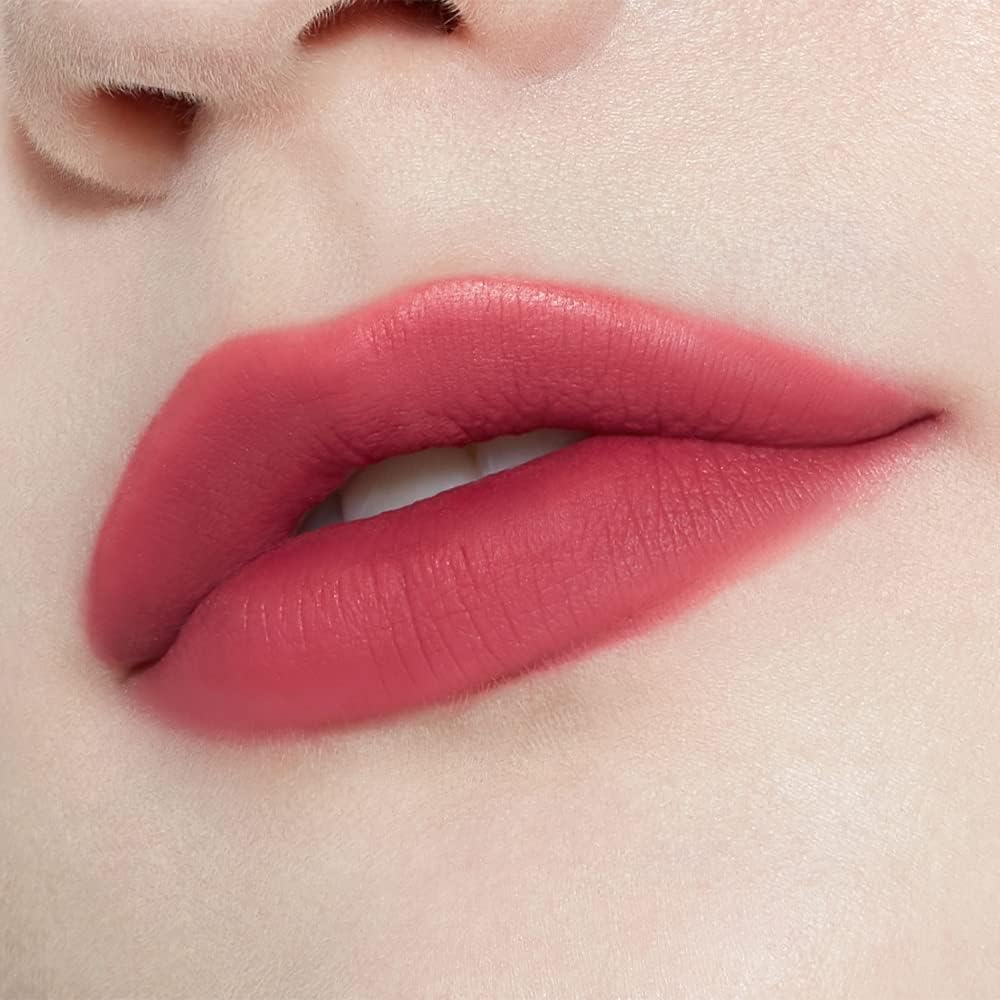 Swatch of the long lasting high pigmented lipstick in Cranberry Plum on a neutral background.