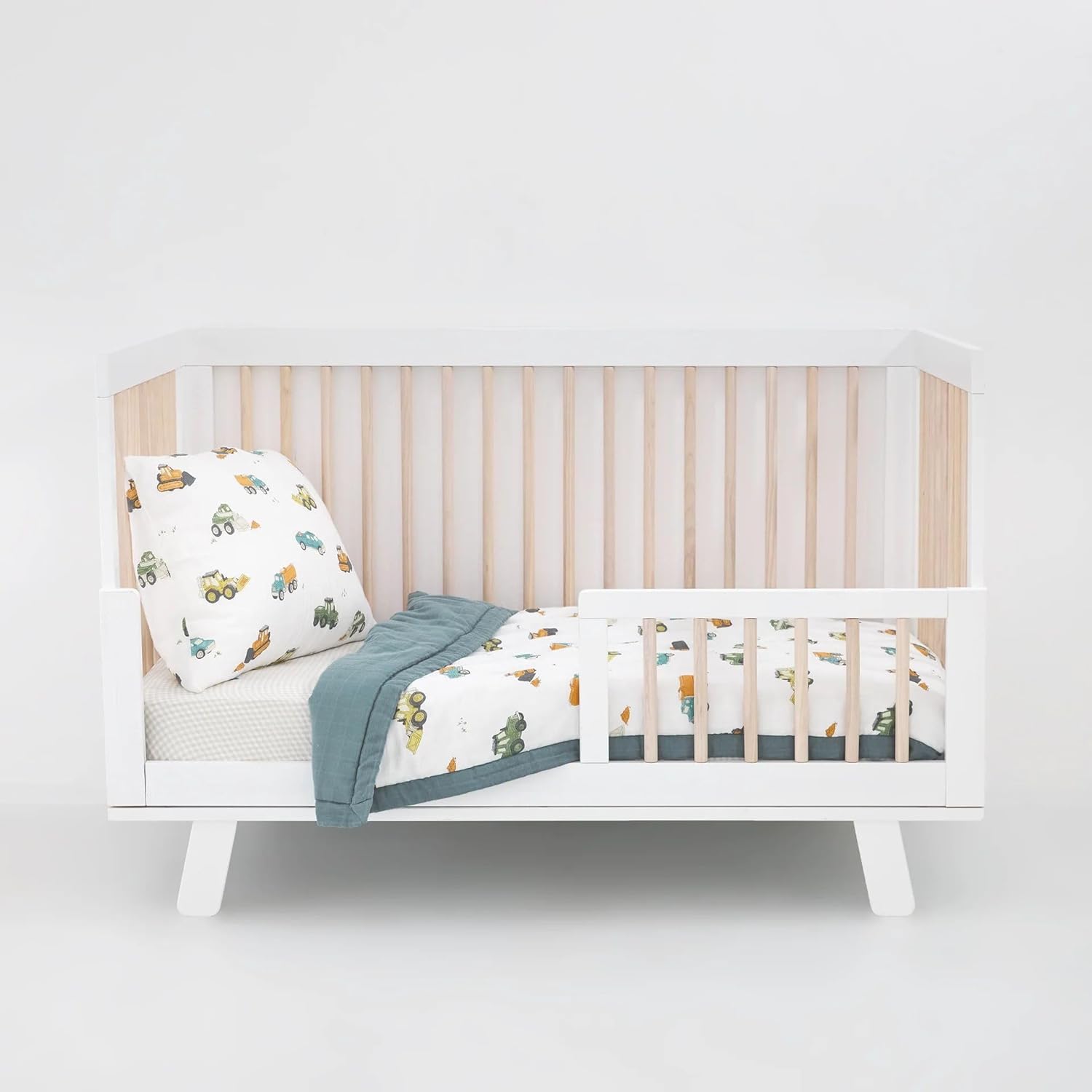 Little Unicorn toddler bedding 3 piece set in work trucks print layout