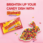 Someone holding the 14 Ounce bag of imported Starburst original candy during a road trip.