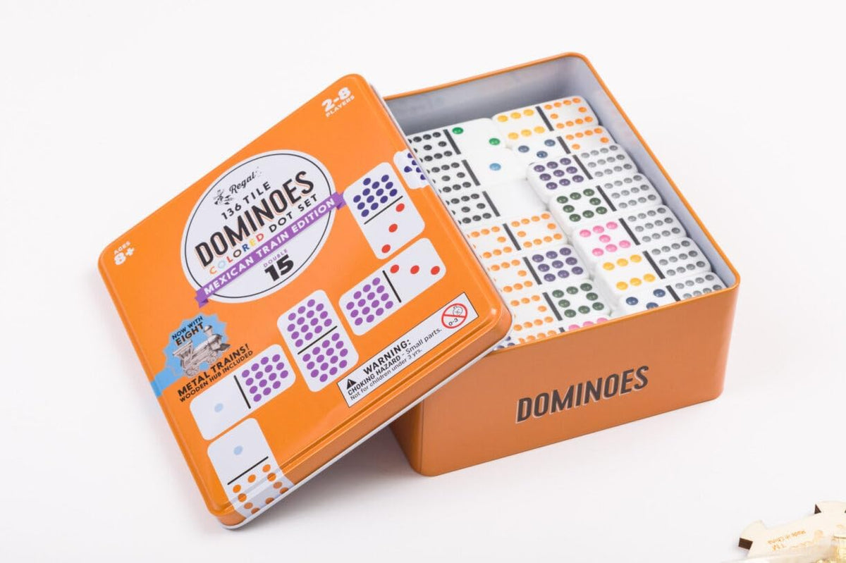 Metal train tokens displayed alongside double 12 domino pieces