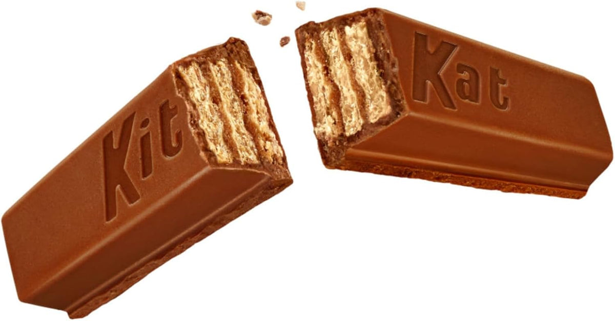 Crispy wafer fingers coated in smooth milk chocolate snapped open to reveal layers.