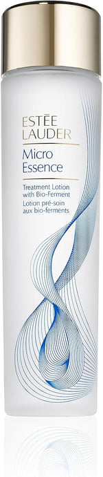 Estée Lauder Micro Essence skincare toner bottle positioned alongside premium cosmetics
