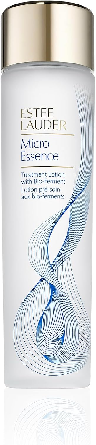 Estée Lauder Micro Essence skincare toner bottle positioned alongside premium cosmetics