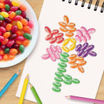 A glass bowl filled with authentic Starburst fruit flavored jelly beans for festive celebrations.