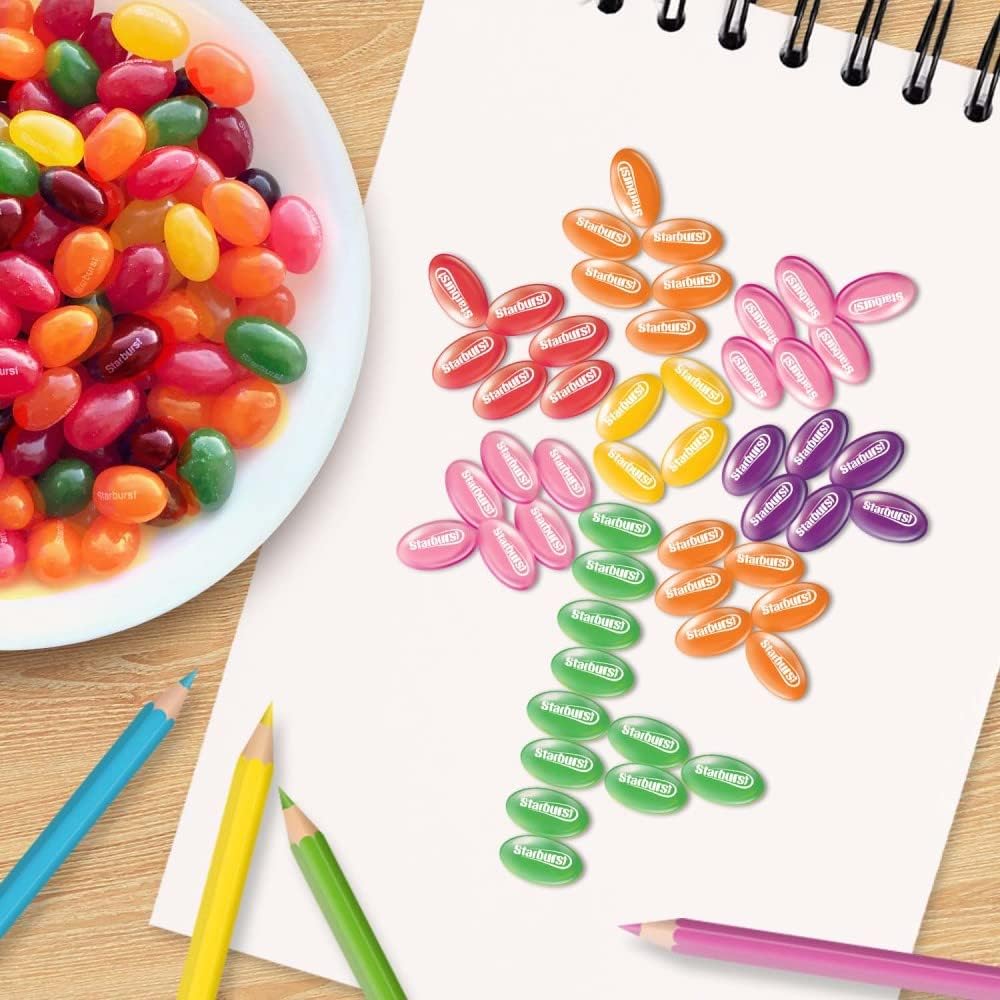 A glass bowl filled with authentic Starburst fruit flavored jelly beans for festive celebrations.