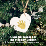 Complete contents of the baby handprint ornament kit including shaping rings, paints, and ribbons.