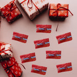 A handful of individually sealed red confectionery twists highlighting convenient snack packaging.