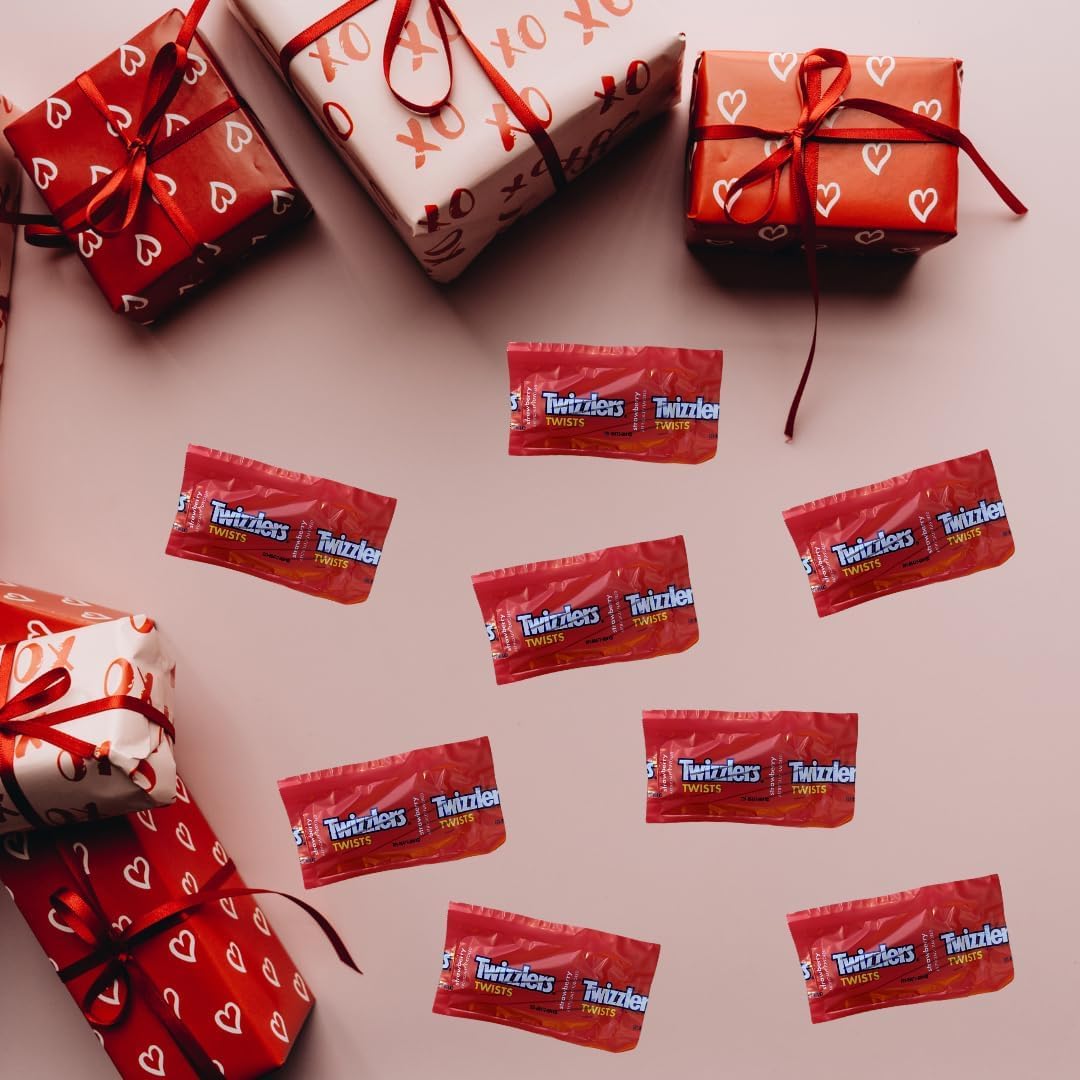 A handful of individually sealed red confectionery twists highlighting convenient snack packaging.