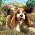 Side view of Folkmanis dog plush puppet in brown white and black colors