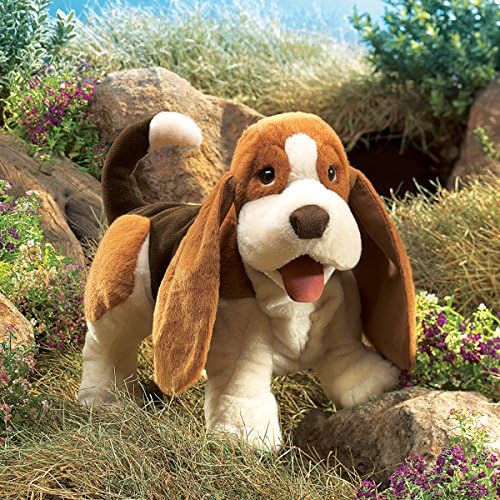 Side view of Folkmanis dog plush puppet in brown white and black colors